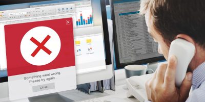 Business professional resolving electronic invoicing validation errors and compliance issues in Lithuania.
