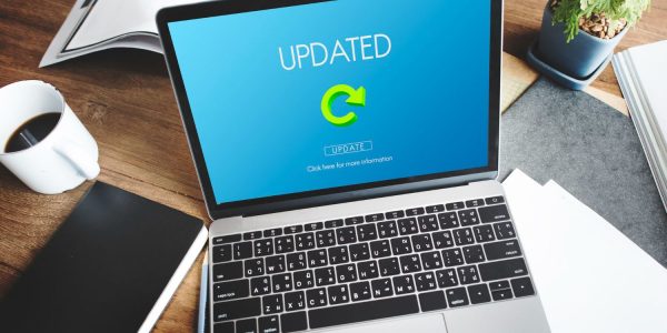 Laptop displaying a software update process representing the CI Accelerator Add-on for SAP Integration Suite.
