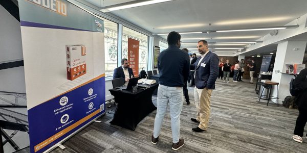 Code10 team member networking at BTP Symposium during UKISUG event