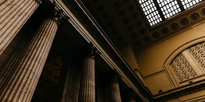 Classical government building interior symbolizing tax compliance and SAF-T reporting in Romania