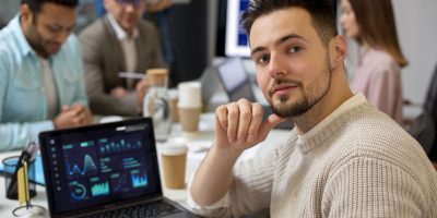 Business professionals analyzing data and dashboards for B2B e-invoicing processes in Germany