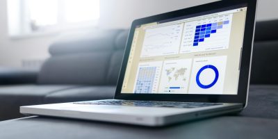 Laptop displaying data analytics dashboard representing electronic invoicing and reporting processes