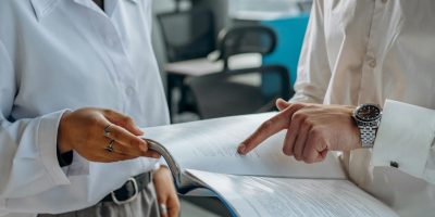 Two professionals reviewing financial report representing VeriFactu tax compliance in Spain