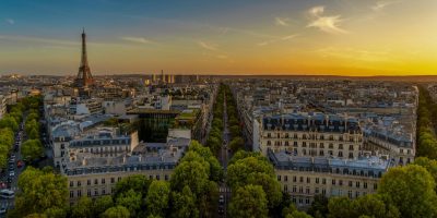 Aerial view of Paris with the Eiffel Tower at sunset, representing digital compliance and e-invoicing regulations in France.