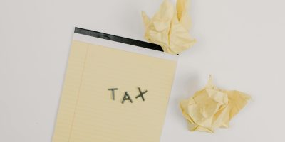 Tax document with crumpled papers representing TicketBAI compliance challenges and corrections